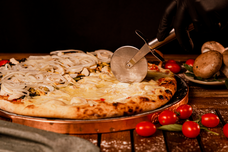 Dewey's Four Cheese specialty pizza with artisan blend